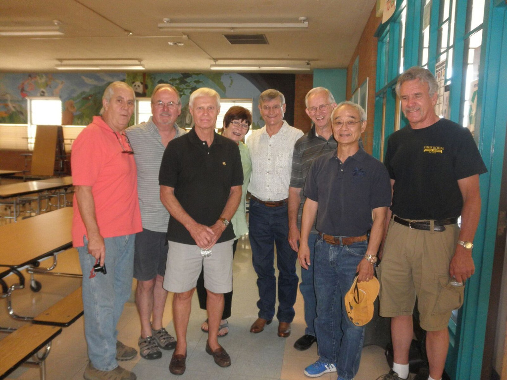 from left - Greg Babcock, Kent Hogan, Tom Nolan, Carol Holland Smith, Tom Moore, Jerry Asbury, Rich Murahata, and Byron Steinacher in the lunchroom