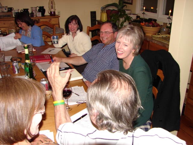 reunion committee laughing at grey haired balding person